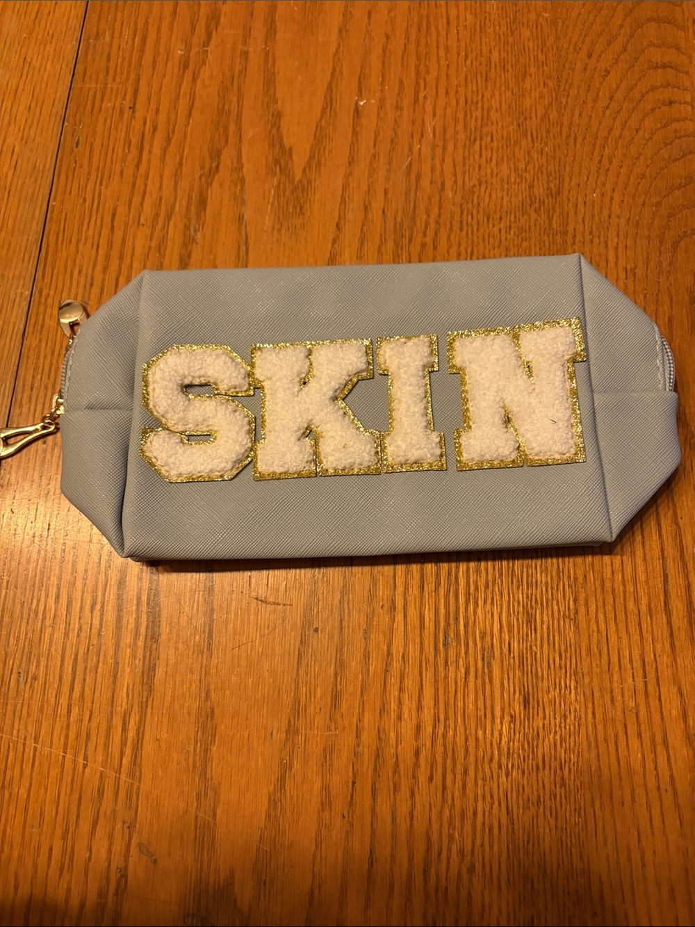(5/$20) Blue Cosmetic Pouch with 'SKIN' Lettering